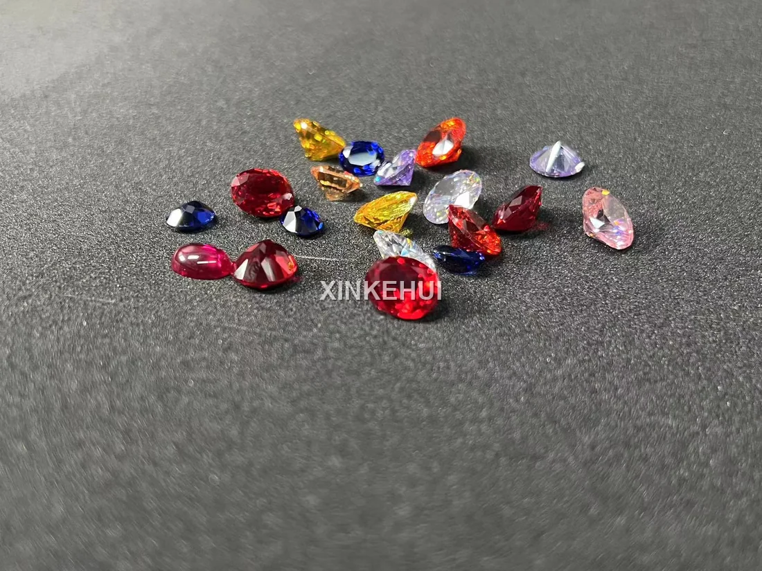Colorful sapphire crystal pieces showing red, blue, yellow and pink hues